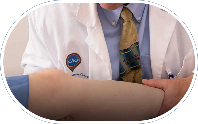 Orthopedic doctor close to Central Maryland assessing a patient's knee.