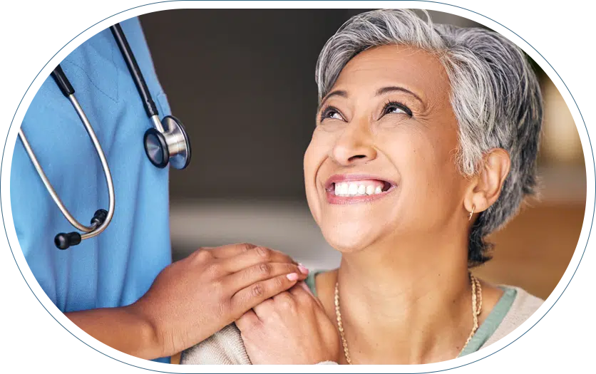 Patient smiling at their orthopedic doctor after providing a positive testimonial.