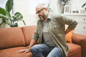 Male Adult feeling back pain