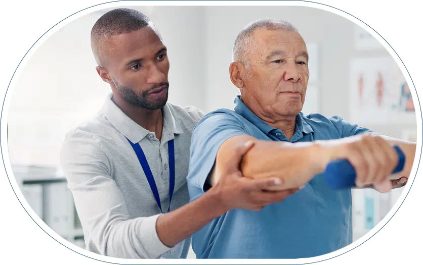 Physical therapist assisting a patient during post-surgery rehabilitation therapy session